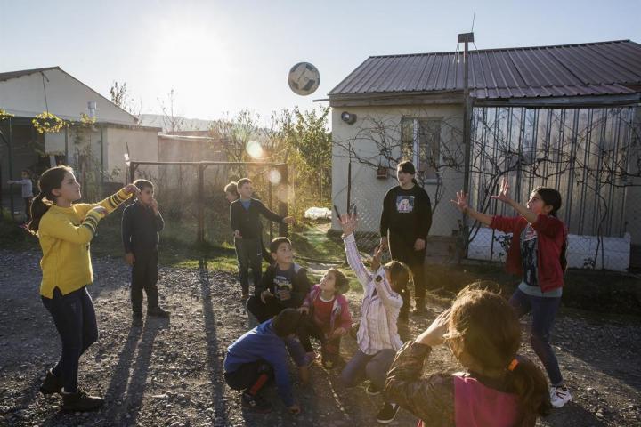 Kids play games outside of the community center in Shavshvebi, the Republic of Georgia. From the series Life After Conflict. ©Pete Muller for the ICC